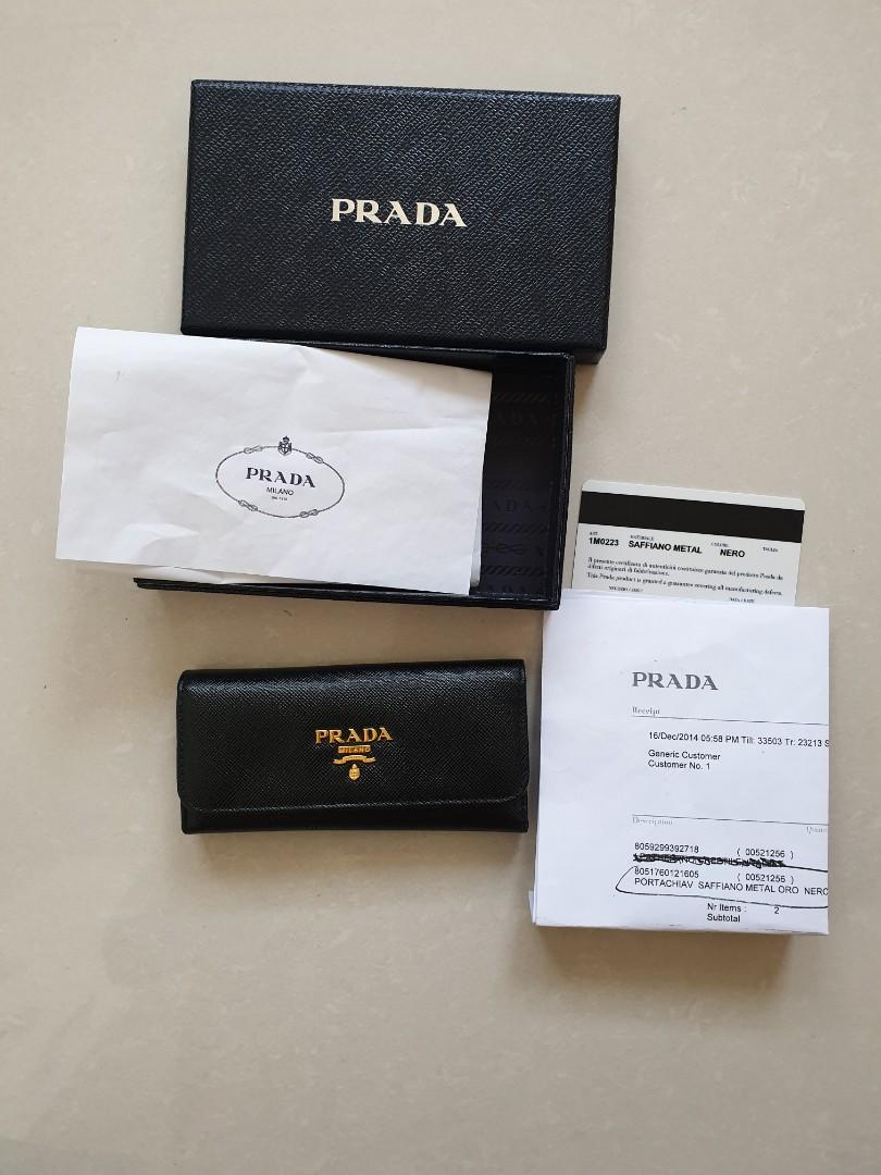 Prada Classic Black Key Pouch Ring Holder (Category: Luxury Bags & Wallets) located in Davao. Submitted by declutter14 (Listing ID 1102724216, Image 1). Description: Authentic 2014 Prada Classic Black with gold hardwares 10yrs na pero maganda pdin syempre preloved not brandnew like fresh sa store-- RTP nasa Php35K with resibo, box, card & paper stuffing Made in italy #181 condition Preloved 85/100 •BAWAL SA BARAT, NOT LAY-AWAY.NOT UKAY •ALWAYS BA