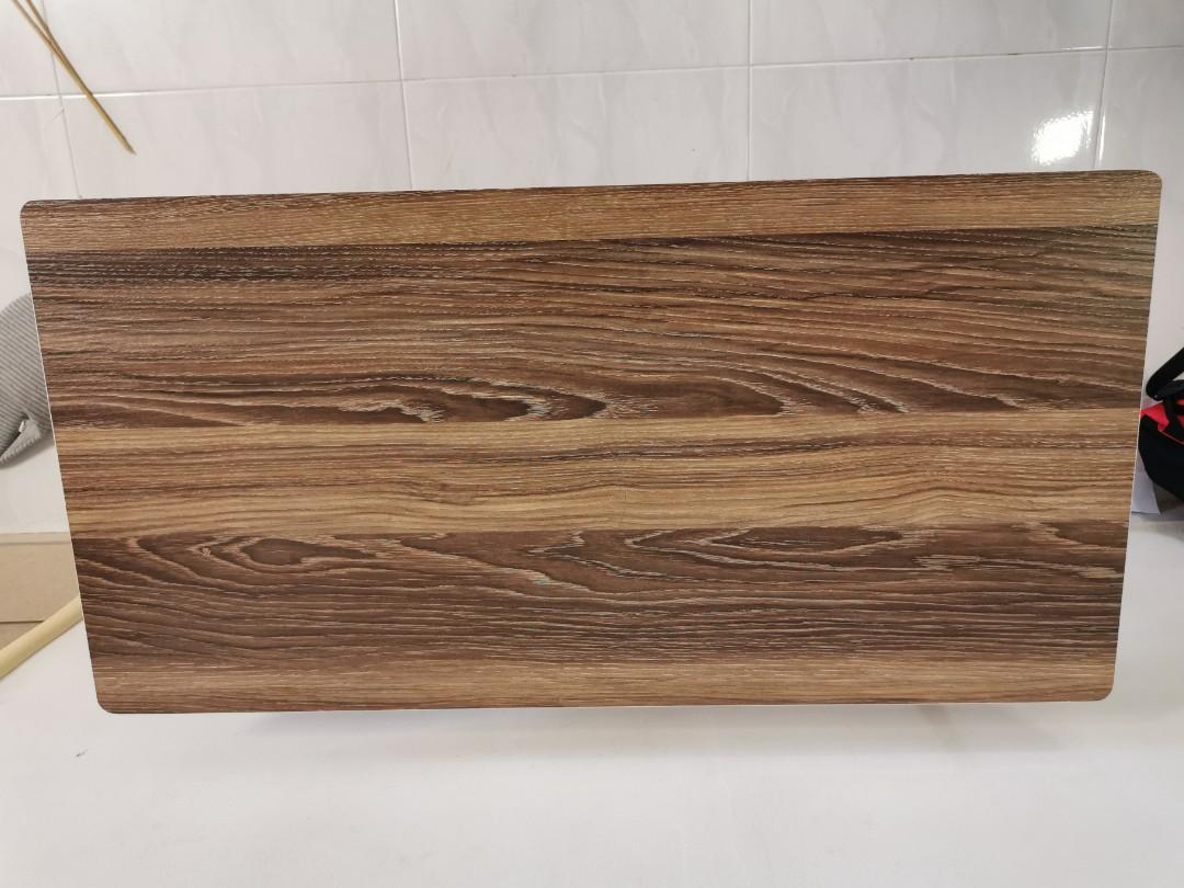 Table (Category: Tables & Sets) located in Singapore. Submitted by canrian (Listing ID 1102784389, Image 3). Description: 1. 80cm*40cm 2. Adjustable height 3. Table legs can slot under bed/sofa. 4. Self-collect at Choa Chu Kang Central.