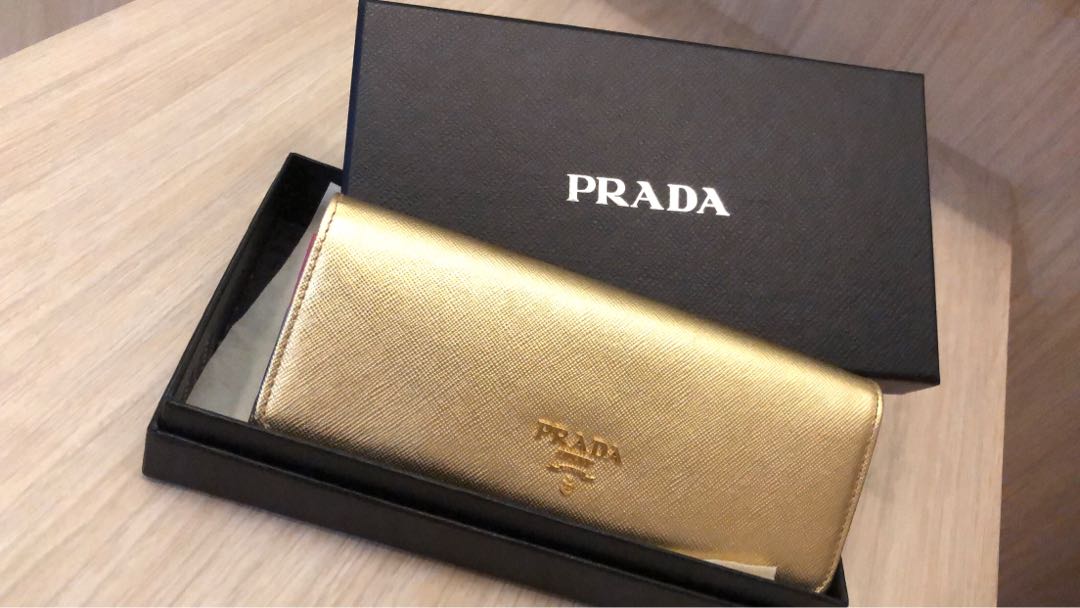 Prada long wallet in gold, Women's Fashion, Bags & Wallets, Wallets & Card  Holders on Carousell