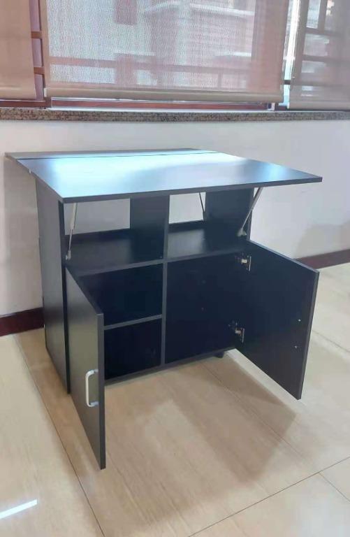 Black Dining Table with Cabinet Foldable Multipurpose Table (Category: Tables & Sets) located in Manila. Submitted by affordshopz (Listing ID 1103399869, Image 3). Description: Multipurpose Table - Actual Picture Posted Actual Size:80*80*79 cm packaging size:81.5*42*21.7 cm packaging weight:27 kg Material : Wooden Black Dining Table Computer Table Laptop Table Study Table 𝕄𝕠𝕣𝕖 𝕒𝕗𝕗𝕠𝕣𝕕𝕒𝕓𝕝𝕖 𝕒𝕟𝕕 𝕢𝕦𝕒𝕝𝕚𝕥𝕪 𝕚𝕥𝕖𝕞𝕤? 𝑽𝒊𝒔𝒊𝒕 
