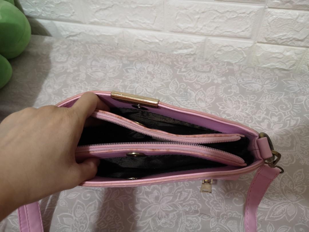 Original Kimbel Sling Shoulder Bag Pink (Category: Shoulder Bags) located in Bacoor. Submitted by zanrii.ph (Listing ID 1103430308, Image 3). Description: Original Kimbel Sling Shoulder Bag Like new Seldom used Bought for 1000+ pesos Compartments: -1 outer -3 inner compartments -3 inner pockets Issue: Minimal signs of usage Stain due to storage near zipper area (see pic).