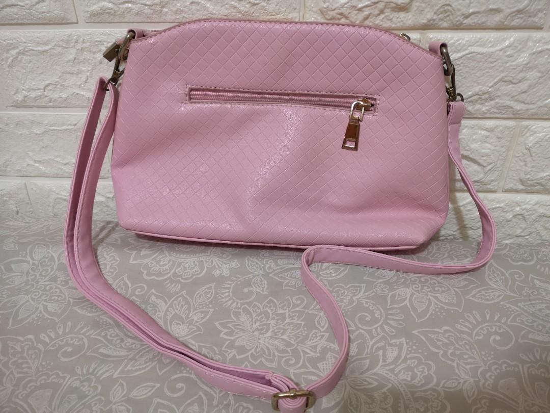 Original Kimbel Sling Shoulder Bag Pink (Category: Shoulder Bags) located in Bacoor. Submitted by zanrii.ph (Listing ID 1103430308, Image 2). Description: Original Kimbel Sling Shoulder Bag Like new Seldom used Bought for 1000+ pesos Compartments: -1 outer -3 inner compartments -3 inner pockets Issue: Minimal signs of usage Stain due to storage near zipper area (see pic).
