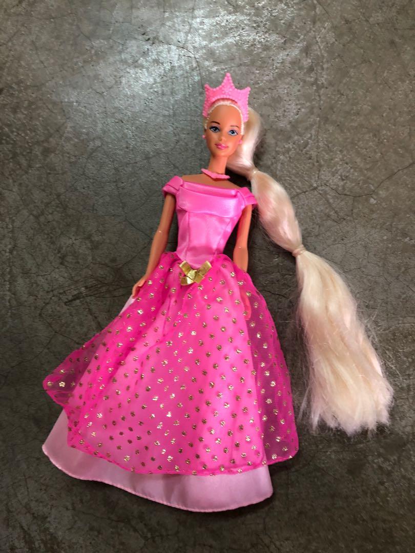 barbie rapunzel pink dress Decided to try and recreate some Barbie Princess Movie dresses here's the first one! its rapunzel's main pink dress makes me wish we had a paintbrush hand accessory so it would represent
