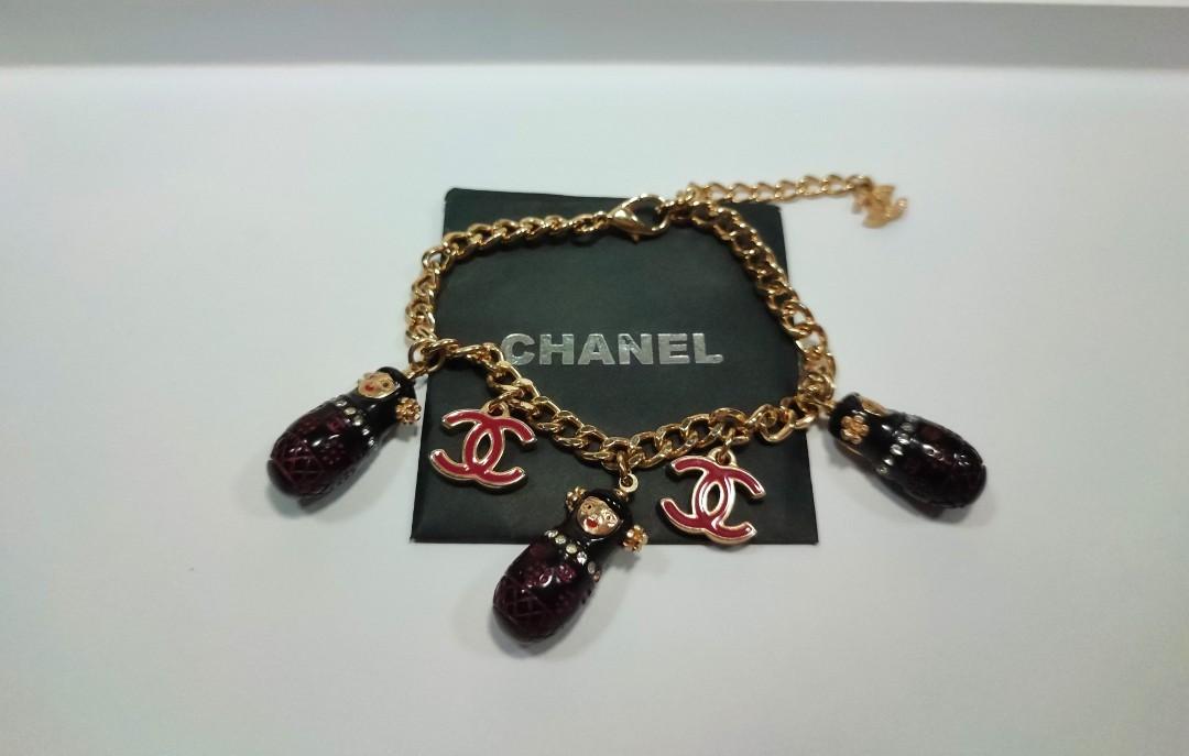 Sold at Auction: Chanel Russian Doll Charm Bracelet