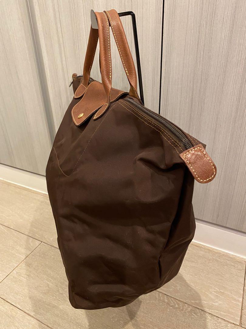 Authentic Longchamp Large Travel bag (Category: Luxury Bags & Wallets) located in Pasig City. Submitted by closetqueen8888 (Listing ID 1103711723, Image 3). Description: Authentic Longchamp Large Travel Bag Pre-loved Mint Condition Flaw: side leather damaged Price: 6,500 + SF.