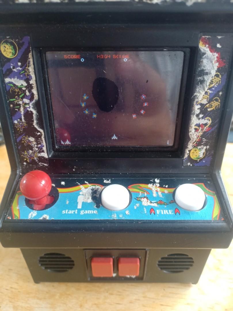 Galaga mini arcade game (Category: Interactive Toys) located in Las Pinas. Submitted by the_recycle_shop (Listing ID 1103734406, Image 2). Description: Vintage Galaga 80's game Mini arcade toy 6 inches tall 4.5 inches width Good working condition.