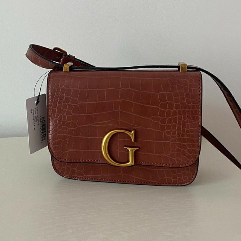 GUESS Corily Crossbody Bag (Category: Cross-body Bags) located in Taguig. Submitted by poshcity (Listing ID 1103724807, Image 3). Description: ✨PLEASE MAKE READING A HABIT✨ Facebook page: @poshcity Stated down below all the details and informations about the item. Shop at your own risk. BAGS ARE ALL ON HAND 💕 👜: GUESS Corily Crossbody Bag ✨: Black, Tan, Red, Gold and White ❎NO COD OR COP— Payment first policy ❎FORM FOR SURE BUYERS ONLY .