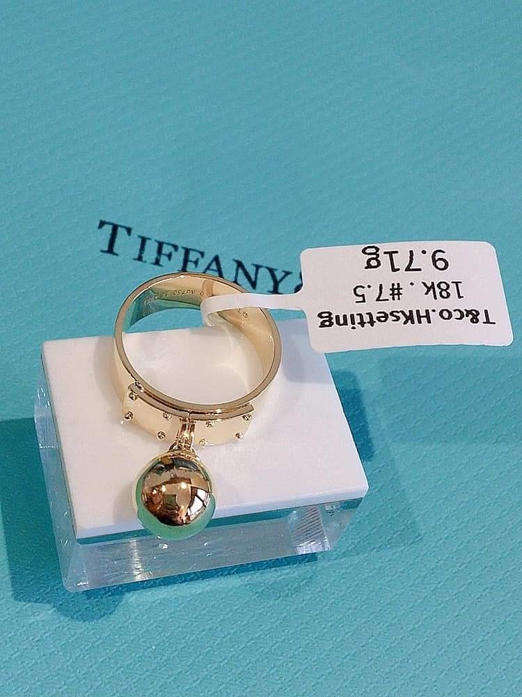 Tiffany ball dangle ring. | Tiffany gold, Rings, Dangles