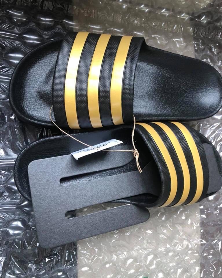 black and yellow adidas slides