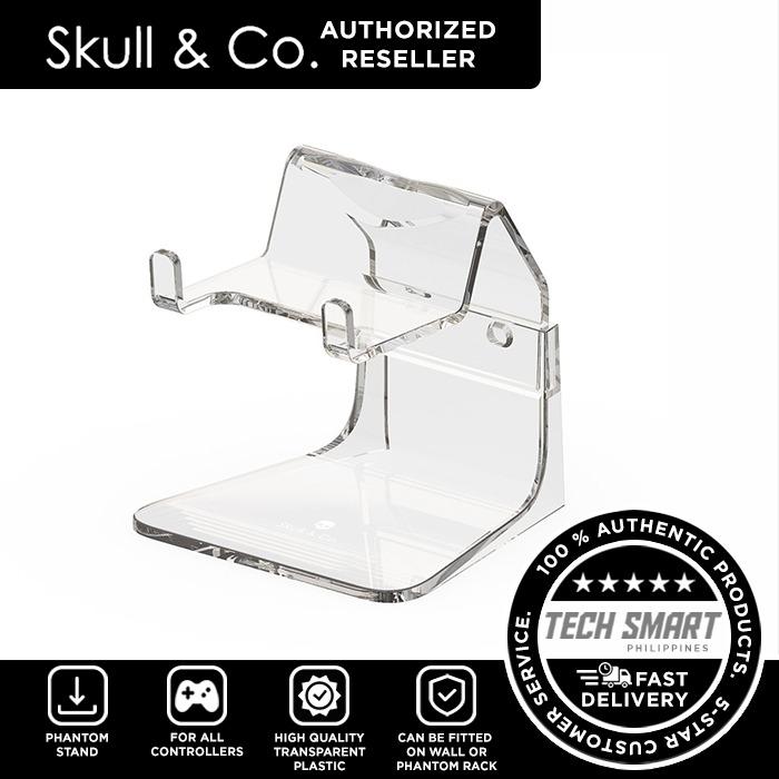 Skull & Co Phantom Stand Controller Stand for All Controllers (Category: Controllers) located in Manila. Submitted by techsmartph (Listing ID 1103955069, Image 1). Description: * Minimum presence, Maximum showcase - made of transparent plastic which best displays your controllers * Cut-out for the headphone jack - no need to unplug headphone when putting controller onto the Phantom Stand * Modular design - can be fitted to the wall or the Phantom