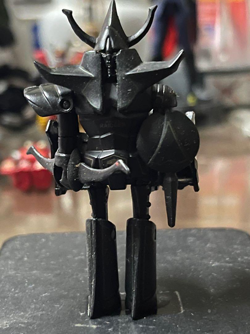 BRAVE RAIDEEN BLACK BAINDAI POPONICA (Category: Figurines & Statues) located in Makati City. Submitted by tudortiger2000 (Listing ID 1104279959, Image 1). Description: Brave Raideen Black GT-06b (?) Bandai Gashapon version (?) All plastic Approx. 9 cm tall Item is loose and includes its shield, bow, articulated conversion back piece x2 and articulated left shoulder pauldron, (right side is missing). .
