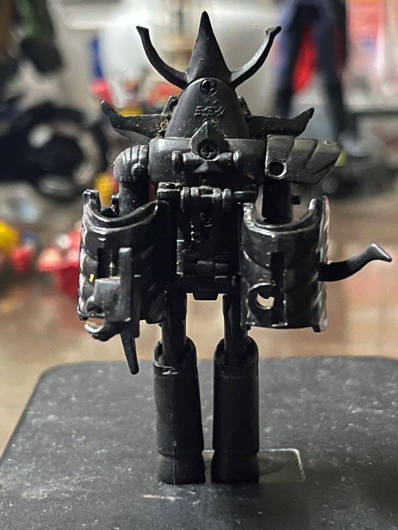 BRAVE RAIDEEN BLACK BAINDAI POPONICA (Category: Figurines & Statues) located in Makati City. Submitted by tudortiger2000 (Listing ID 1104279959, Image 3). Description: Brave Raideen Black GT-06b (?) Bandai Gashapon version (?) All plastic Approx. 9 cm tall Item is loose and includes its shield, bow, articulated conversion back piece x2 and articulated left shoulder pauldron, (right side is missing). .
