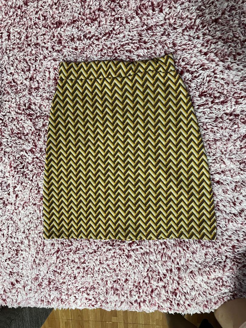 Chevron skirt (Category: Skirts) located in Quezon City. Submitted by savespaces (Listing ID 1104237264, Image 3). Description: Skirt with chevron pattern and cream buttons • di siya actually binubutton ahahhaha decor lang yung button ganern • used twice, great condition • fits xs-s but stretchy • 5th pic is how it looks like when worn rfs: decluttering but also doesnt fit na hahahahahah charge to quarantine weight gain mga sis.