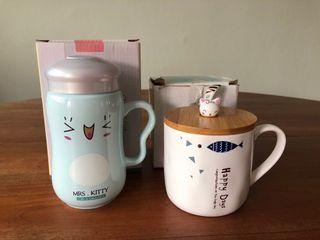Mugs with lids (shorter one has tea spoon too)