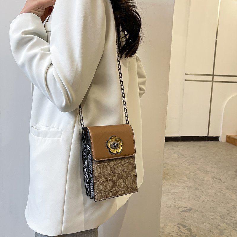 Tas sling online bag coach
