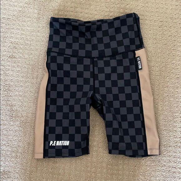 PE Nation Snapshot Checkered Bike Shorts in Charcoal Size S (Category: Women's Clothes) located in Sydney. Submitted by secretclosetofastylist (Listing ID 1098771460, Image 3). Description: RRP $100. Sold out. Also selling the matching crop top New without tags Material Composition 65% Recycled Nylon, 35% Elastane. Drying Instructions Lay Flat To Dry. Washing Instructions Machine Wash Cold. Care Instruction Symbols Do Not Bleach. The Snap Shot Sh