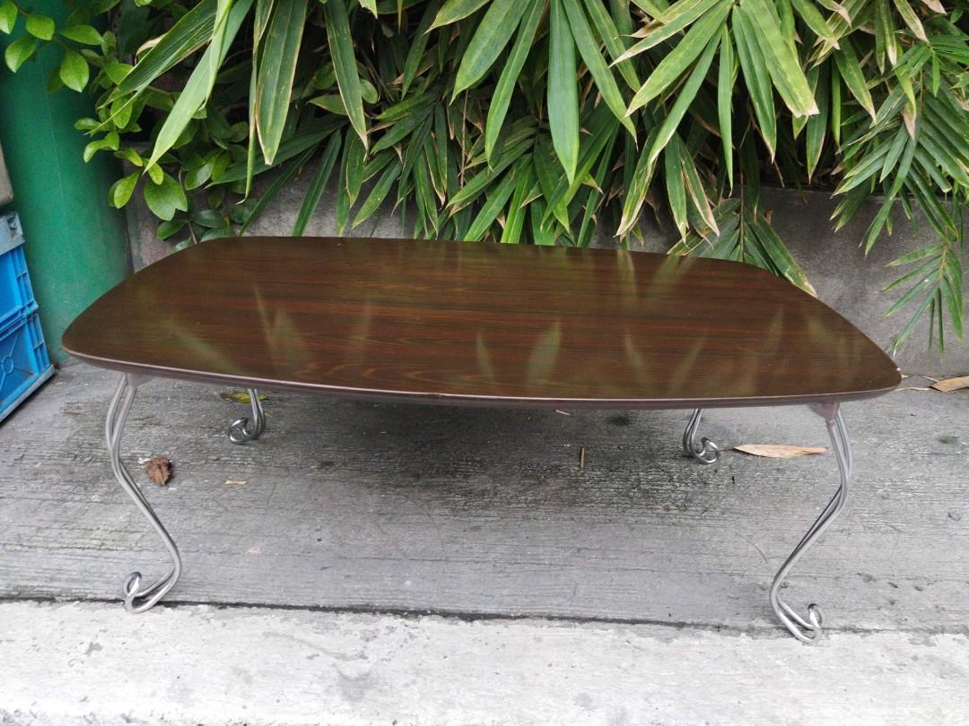 Brown Low Folding Table (Category: Tables & Sets) located in Manila. Submitted by benjie.benjie3 (Listing ID 1099089136, Image 2). Description: Model= brown low folding table Open table H= 35 cm L= 90 cm W= 60 cm Folded table H= 9 cm Color = brown Material = wood and metal 2nd hand with scratch No warranty If there's Damage or Issues they can be seen in the last picture From japan Price = 1,700 No swapping please. Price does not include shipping 