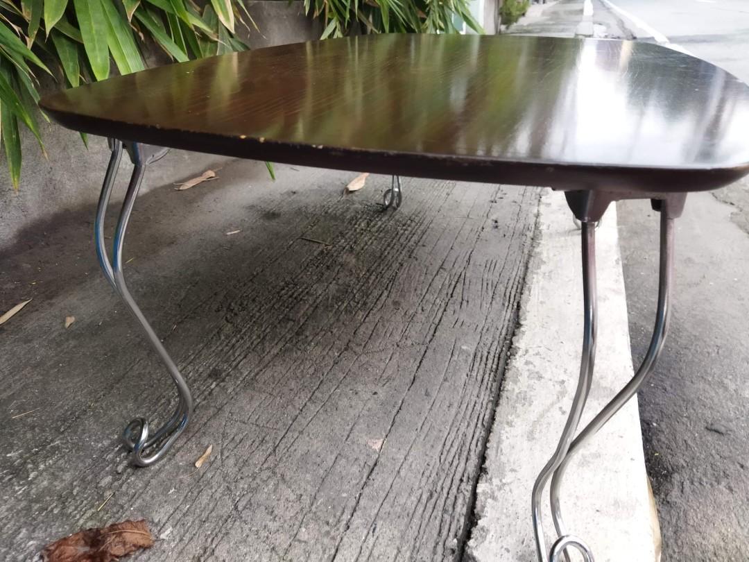 Brown Low Folding Table (Category: Tables & Sets) located in Manila. Submitted by benjie.benjie3 (Listing ID 1099089136, Image 3). Description: Model= brown low folding table Open table H= 35 cm L= 90 cm W= 60 cm Folded table H= 9 cm Color = brown Material = wood and metal 2nd hand with scratch No warranty If there's Damage or Issues they can be seen in the last picture From japan Price = 1,700 No swapping please. Price does not include shipping 