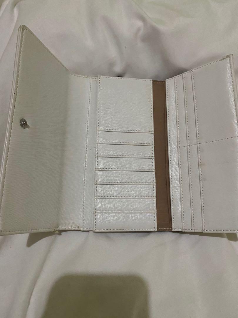 Calvin Klein Authentic Three-fold Monogram Wallet (Category: Wallets & Card holders) located in Makati City. Submitted by sheishops (Listing ID 1099013725, Image 3). Description: Brand: Calvin Klein Design: Monogram three-fold Color: White (body), yellow (accents) *Used once only There’s a bit of a damage as seen in photos Reason for selling: Owner does not use it. Stuck in a drawer..