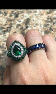 Pear cut green emerald with diamond ring