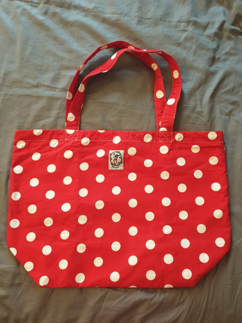 Red polka dot store purse