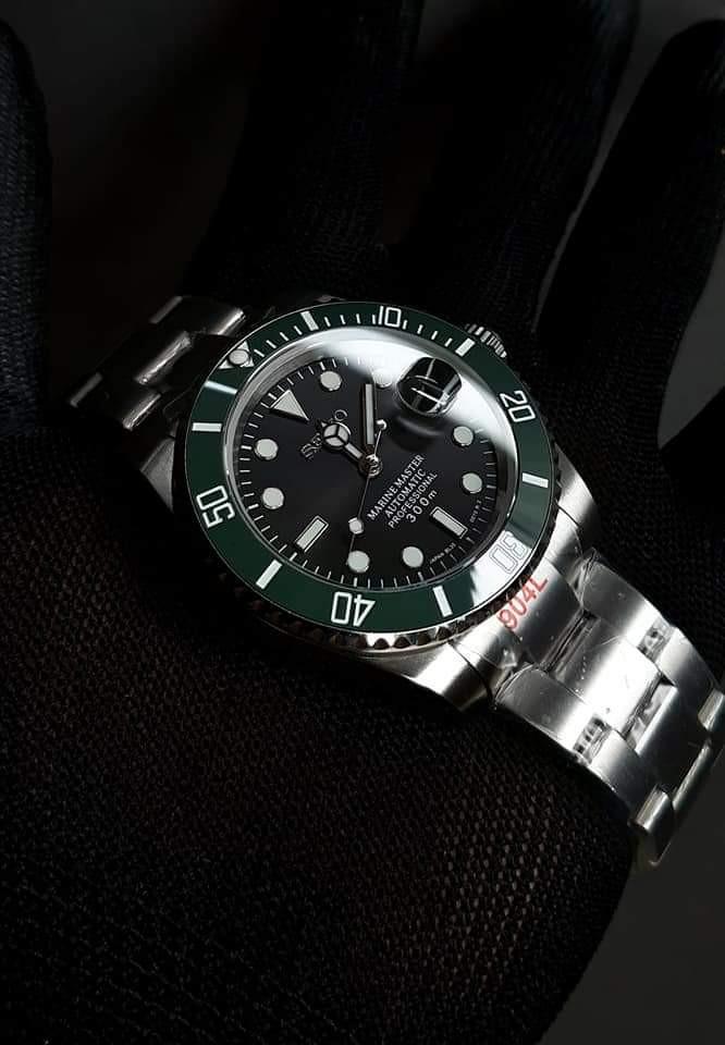 Seiko/Rolex Homage Mod 40mm (Category: Luxury Watches) located in Manila. Submitted by markwrist07 (Listing ID 1083267770, Image 1). Description: Seikolex Homage Mods 40mm restocked and repriced at PHP14,999! PM us for orders! 🙏 New and Improved 904L stainless steel Seikolex Homage Mod 40mm • SUBMARINER • YACHTMASTER • GMT Specifications: - 904L stainless steel Sub Case 40mm - Sapphire Crystal with date cyclops - 904L Solid Links and Endlinks Oy