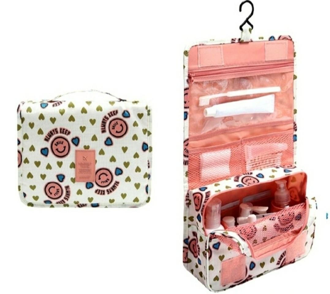 Multi function storage bag (Category: Travel Essentials & Accessories) located in Singapore. Submitted by ashcloub (Listing ID 1099658123, Image 2). Description: -nylon material -weight: 0.13kg -size: 22x 18x 8cm -white and pink smile design -can put cosmetics or shower products -courier (additional $3.90) or mailing.