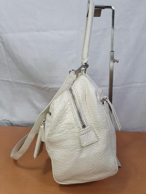 Eudon Choi EC2 (Category: Luxury Bags & Wallets) located in Pasay City. Submitted by sale_hunter (Listing ID 1104506748, Image 3). Description: Preloved bag Issue: slightly oxidize leather Size: Medium Color: Off white/ Vanilla Material: Leather * 2 Way Mode of Payment: Gcash, BPI Bank Transfer Shipping options 1. LBC (MOP) 2. Shopee check out: J&T, Gogo Express (link to be sent once offer accepted) Location: Pasay City, Metro Manila.