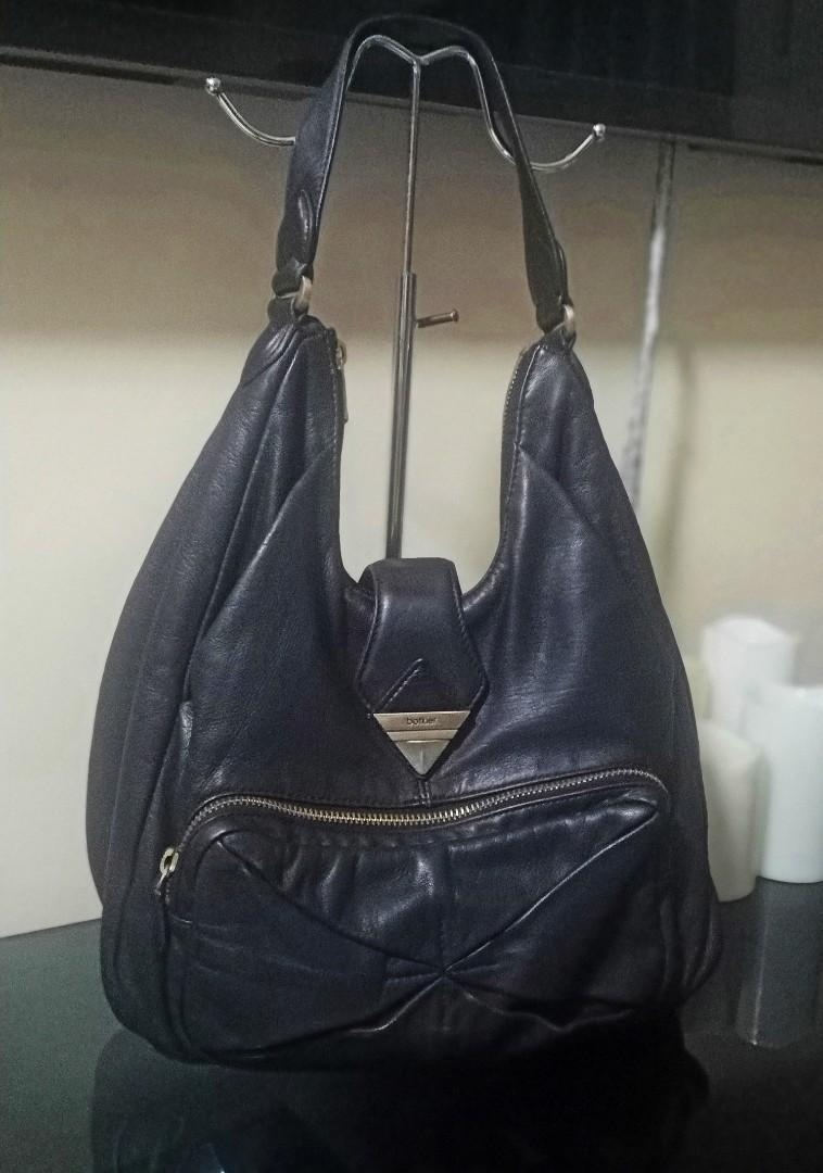 Botkier Hobo Shoulder Bag (Category: Shoulder Bags) located in Quezon City. Submitted by lamoure_demavie (Listing ID 1106326002, Image 2). Description: -preloved -authentic -medium -genuine buttery soft leather -signs of use -light scuff -not noticeable partial rough to touch rubs at the bottom back portion -partial rubber seal cracks -light hardware coat fading.