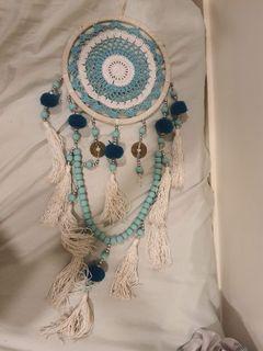 boho-inspired dream catcher in turquoise and white