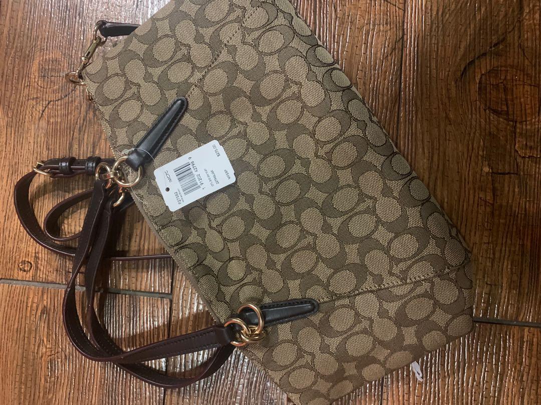 Authentic Coach Monogram 2 way bag (Category: Luxury Bags & Wallets) located in Cainta. Submitted by summerda (Listing ID 1106980681, Image 2). Description: Coach Monogram handbag with long strap. Brand new and never been used. Original price: $275 RFS: Decluttering.