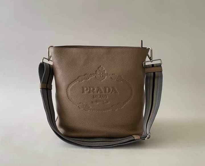 Prada Vitello Phenix 1BE023 (Category: Luxury Bags & Wallets) located in Manila. Submitted by bagislifeshop (Listing ID 1107270287, Image 2). Description: 99% NEW PRADA VITELLO PHENIX 1BE023 Store Price almost 100k Multi-way convertible bag Cammeo -designer colour Vitello Phenix leather with Jacquard font logo and Triangular classic logo on one side Shiny silver hardware Dimensions-12”x11”x6” Adjustable & detachable web strap Good as new, no flaw