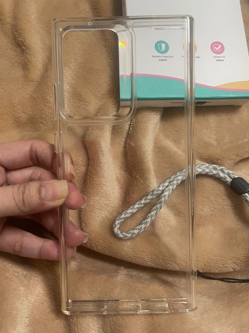 Note 20 ultra case ESR clear with Ringke strap (Category: Cases & Sleeves) located in Manila. Submitted by aneajmik (Listing ID 1107544169, Image 2). Description: Still in good condition. Slightly yellow due to daily use. With hairline scratches. With ringke strap...