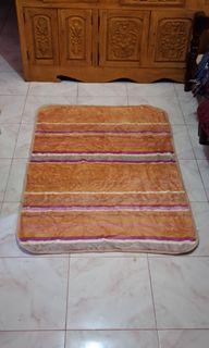 Big orange soft fur carpet 56 by 37 inches
