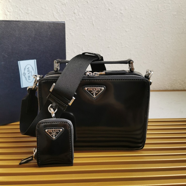 Brique leather crossbody bag in black - Prada