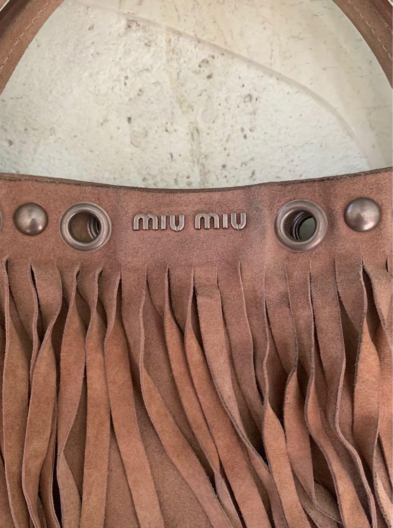 Authentic Miu Miu fringe suede leather bag (Category: Luxury Bags & Wallets) located in Muntinlupa City. Submitted by mjas_treasures (Listing ID 1108158631, Image 2). Description: ig: mjas_treasures Authentic Miu Miu fringe suede leather bag. Made in Turkey 🇹🇷 MOP: BDO or BPI RFS: decluttering 🤗Preloved bag please manage your expectations. Bawal po sa maarte at maselan! 🚫No return, no exchange, no refund!.