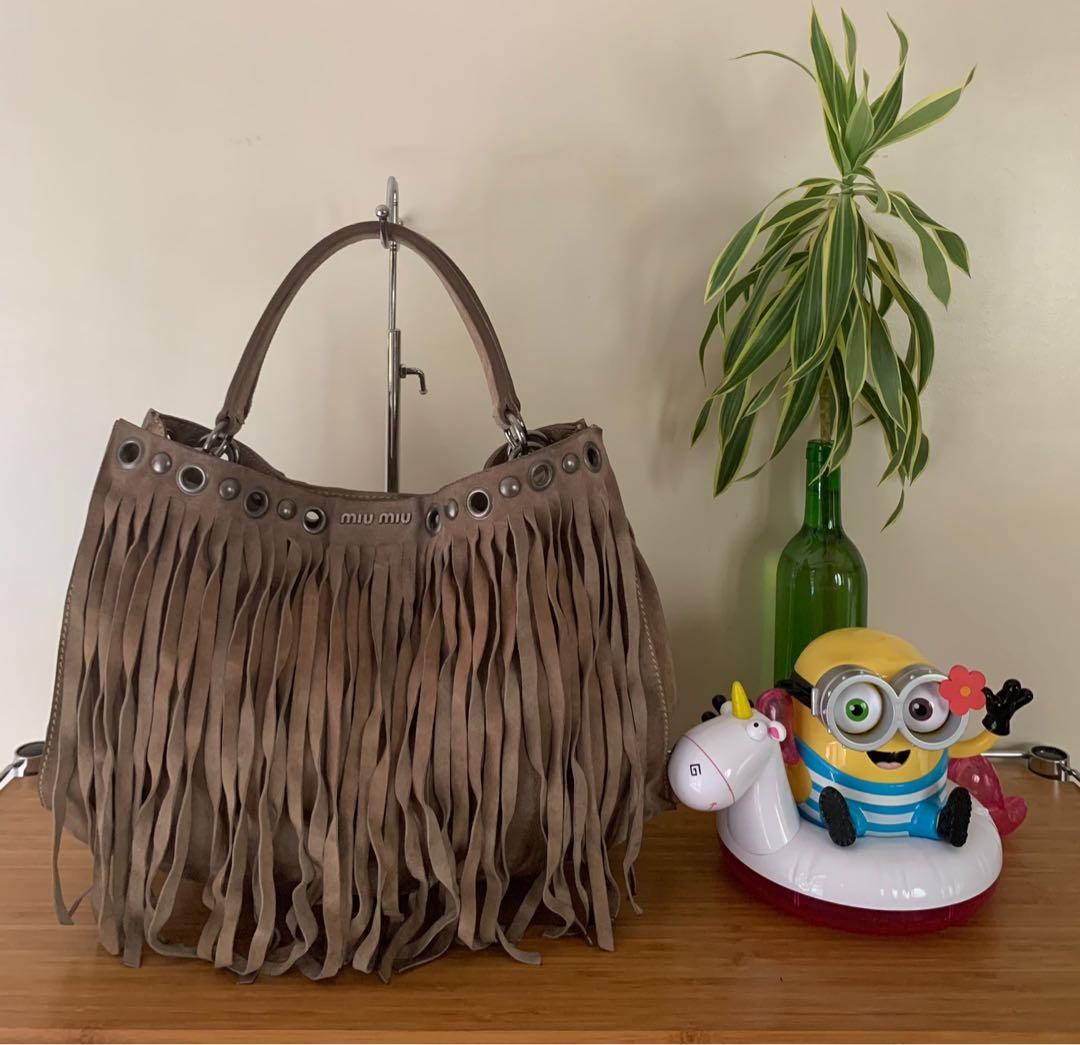 Authentic Miu Miu fringe suede leather bag (Category: Luxury Bags & Wallets) located in Muntinlupa City. Submitted by mjas_treasures (Listing ID 1108158631, Image 1). Description: ig: mjas_treasures Authentic Miu Miu fringe suede leather bag. Made in Turkey 🇹🇷 MOP: BDO or BPI RFS: decluttering 🤗Preloved bag please manage your expectations. Bawal po sa maarte at maselan! 🚫No return, no exchange, no refund!.