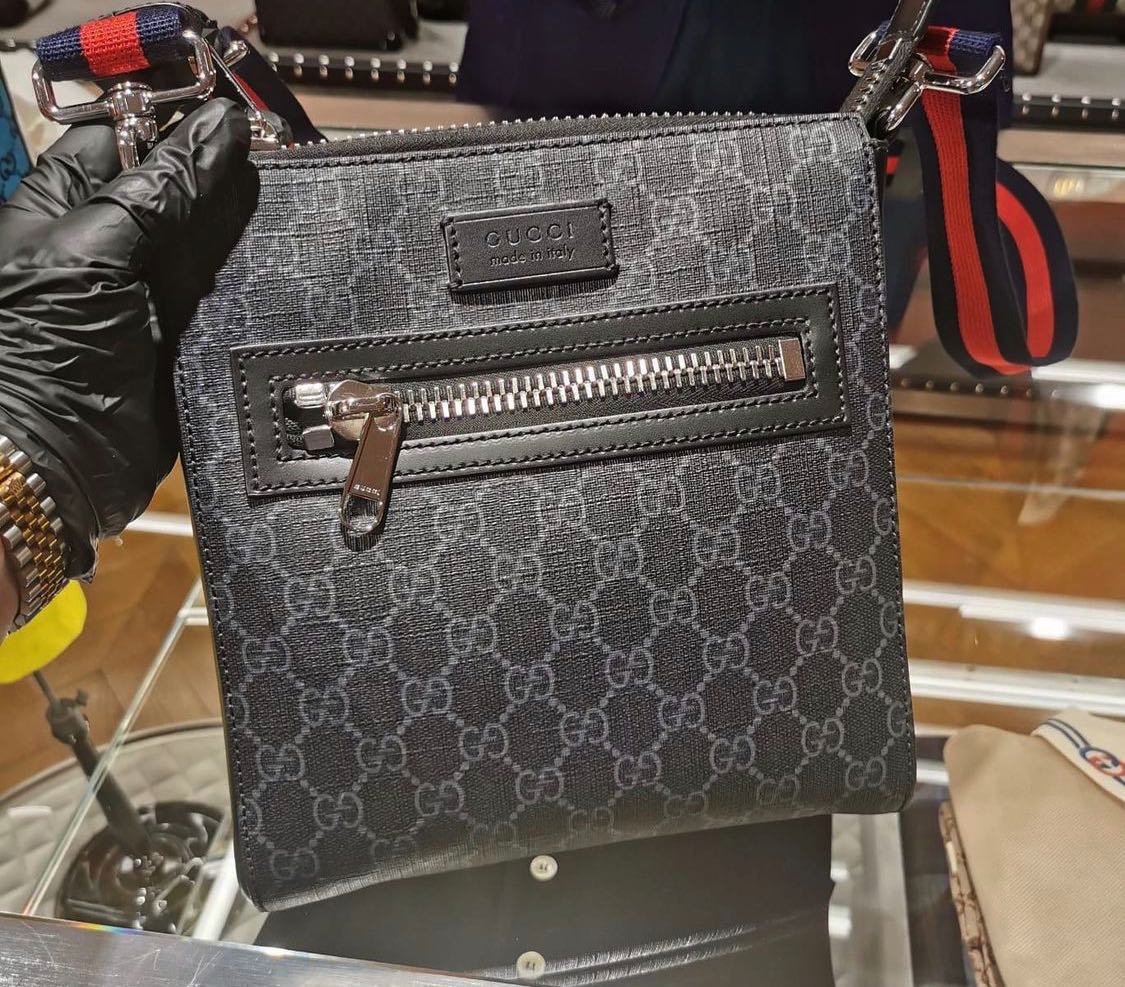 Gucci supreme sling backpack sales