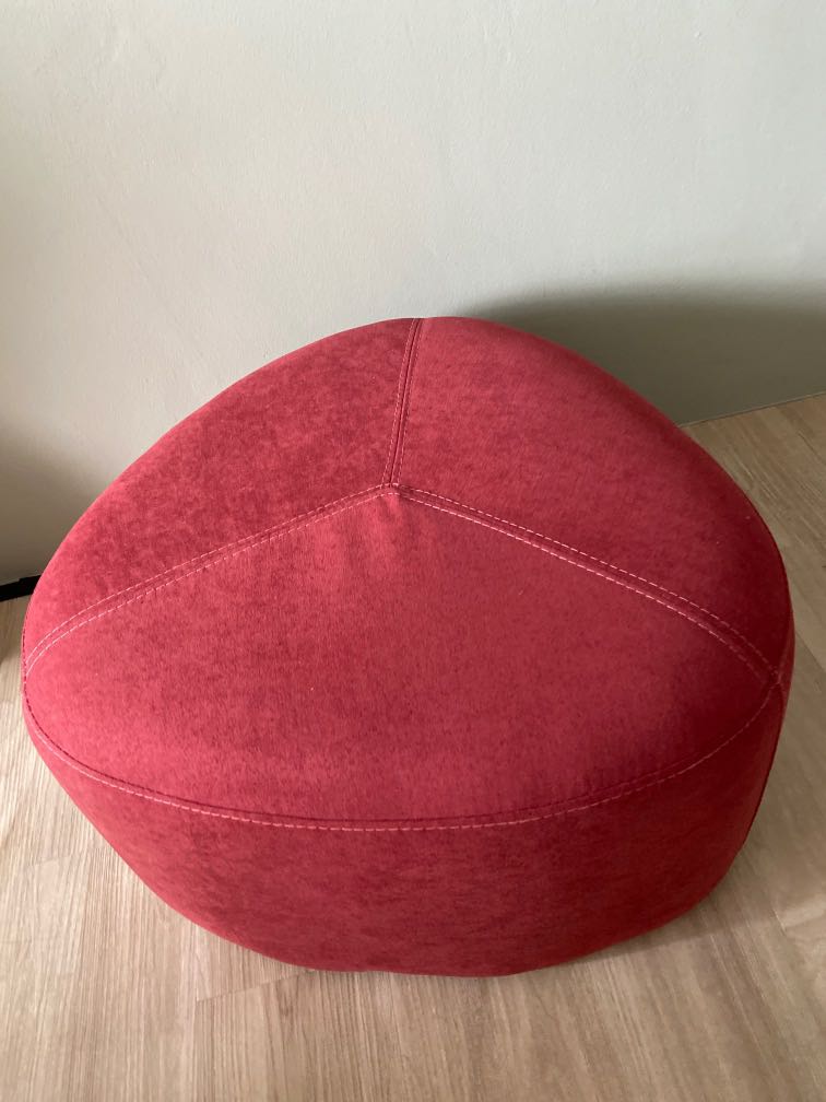 red pouf chair