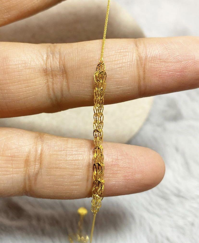 Gold shop feather bracelet