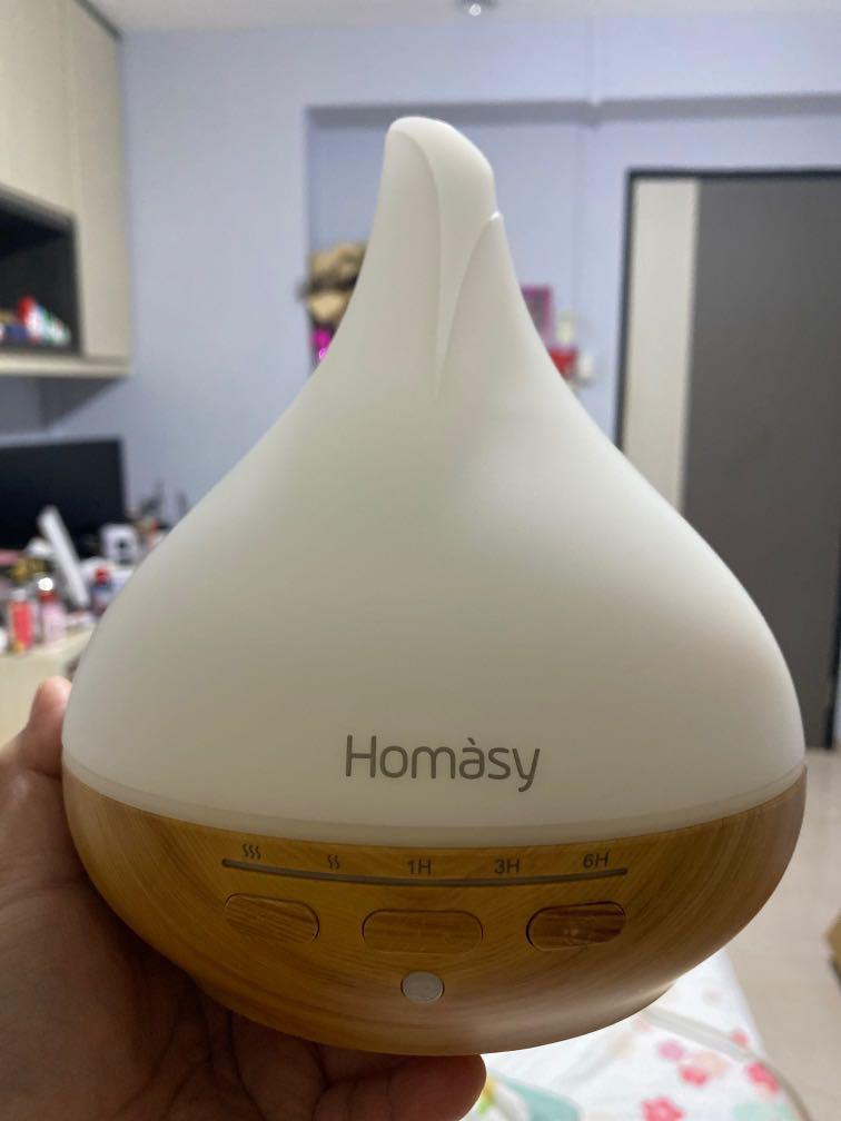 Aroma diffuser homasay (Category: Home Fragrance) located in Singapore. Submitted by petitemcee (Listing ID 1108892621, Image 1). Description: Homasy aroma diffuser Width 170 by height 195mm Led colourful lights W charger Brand new but box packaging old.