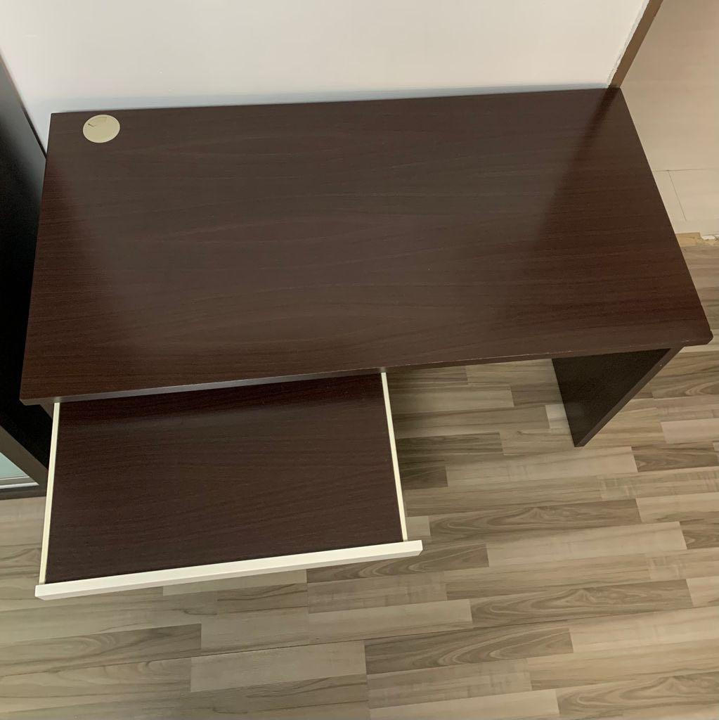 Solid wood study table (Category: Tables & Sets) located in Singapore. Submitted by moanalzy (Listing ID 1108744911, Image 2). Description: Table length: 120cm, width: 60cm, height: 76cm Drawer length: 60cm, width: 40cm -Drawer on the left side of table, cable management port at the top left corner -Dark brown durable solid wood -Please arrange delivery or self pick up at Tampines west area .