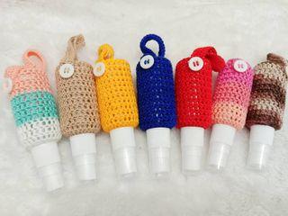 Crochet alcohol pouch with 30 ml spray bottle.