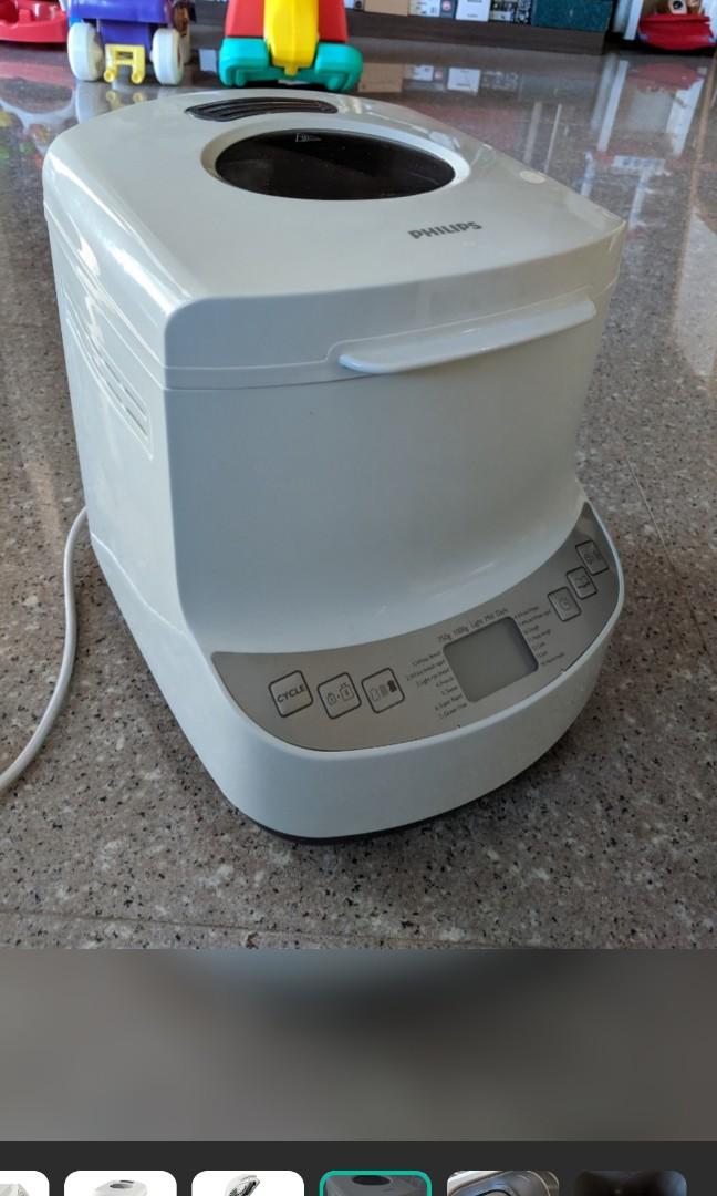 Philips bread maker (Category: Breadmakers) located in Singapore. Submitted by gawsipy (Listing ID 1109080599, Image 2). Description: A lightly used automatic bread maker. put flour, water, yeast, salt and oil and see the magic works..