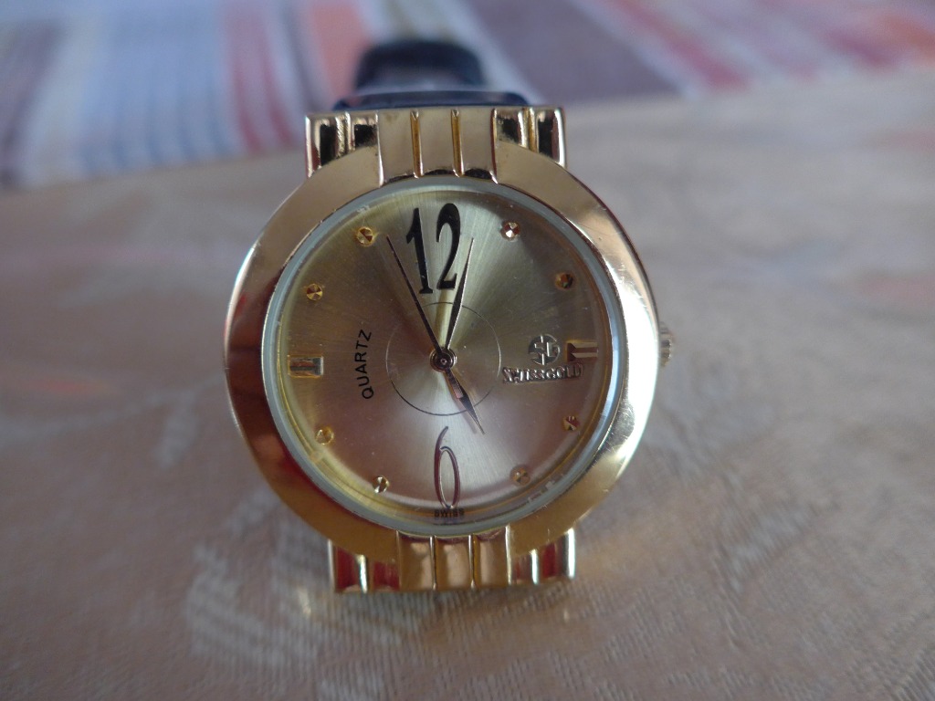 Swiss gold quartz on sale watch