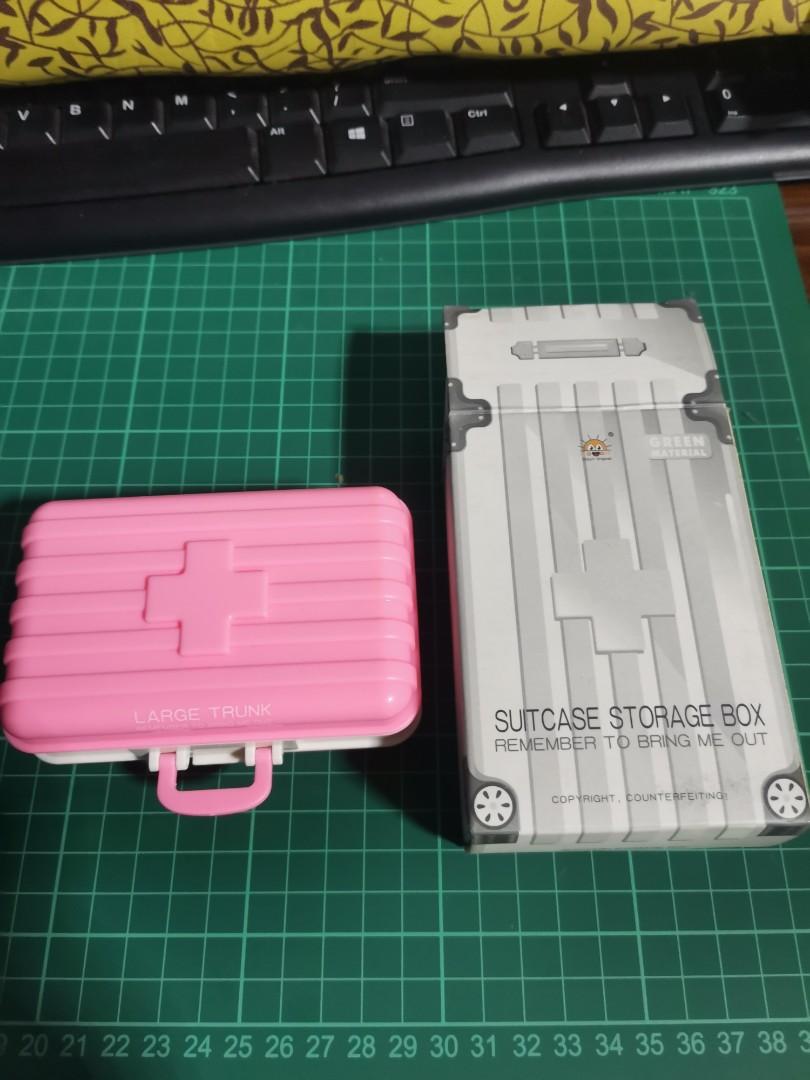 Suitcase storage box for pills color pink from dimensione (Category: Food Organization & Storage) located in Manila. Submitted by GentleGiant (Listing ID 1109317968, Image 1). Description: Unused Small and cute pillbox.