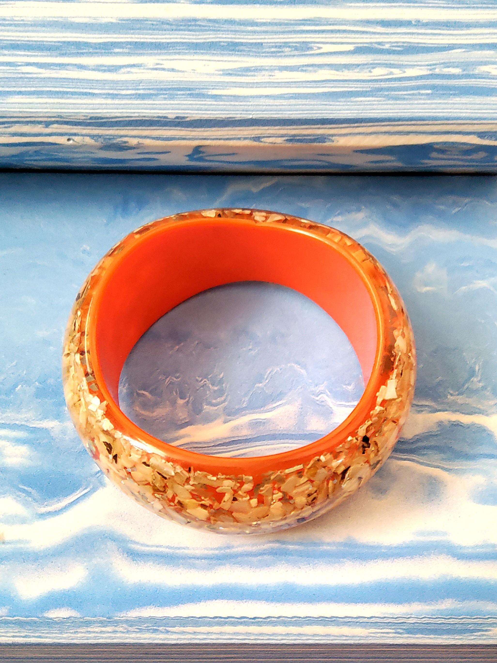 Vintage 70's Orange Resin Chunky Bangle (Category: Bracelets) located in Cainta. Submitted by thrifty_mama (Listing ID 1109195997, Image 1). Description: in excellent condition except with minor flaw in inner bangle. this is more or less a 5 decade old peice from my mom's personal accessories. it still looks exactly the same as i first saw it GCASH SHIPPING ONLY NO PICK UP.