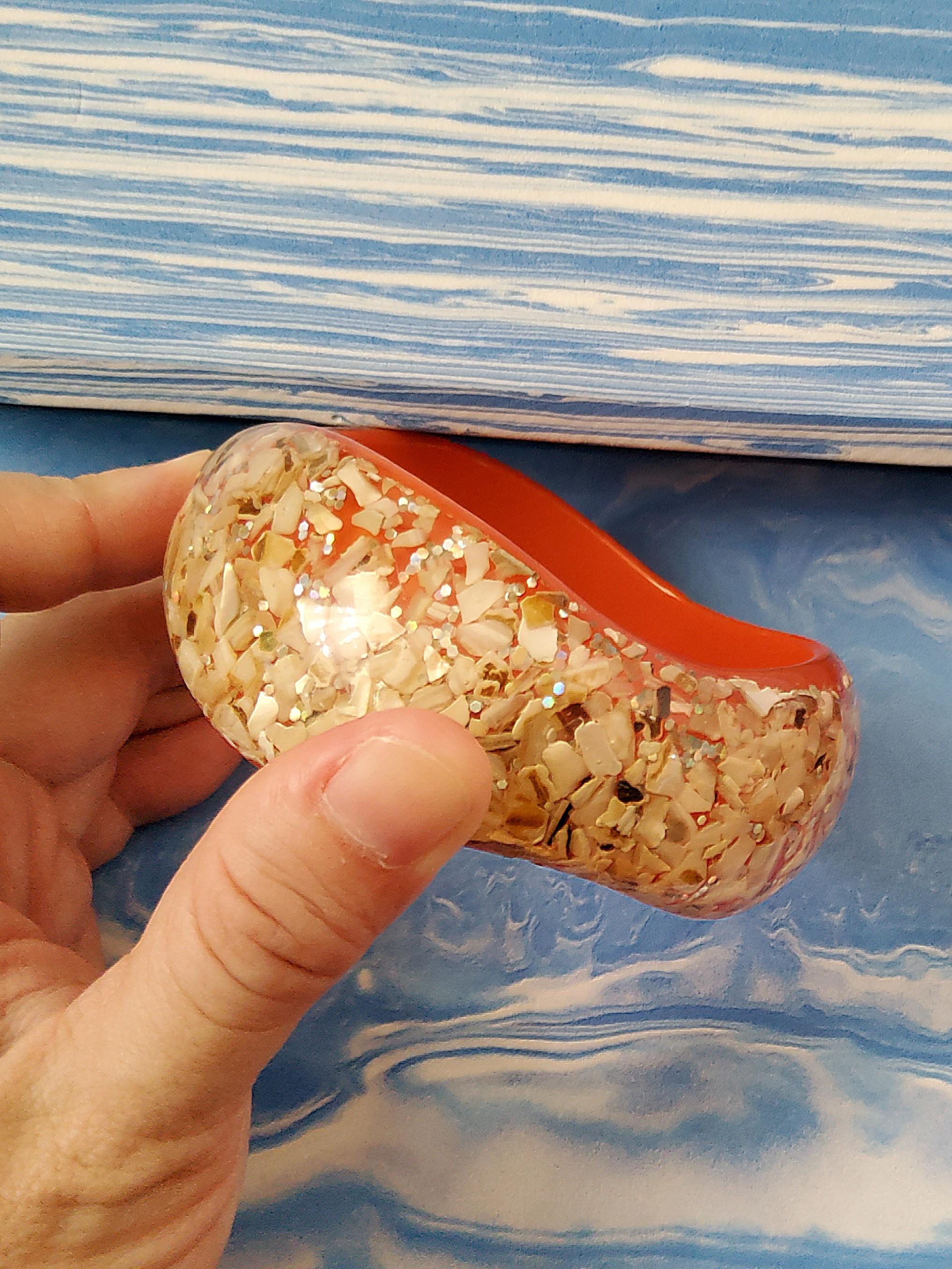 Vintage 70's Orange Resin Chunky Bangle (Category: Bracelets) located in Cainta. Submitted by thrifty_mama (Listing ID 1109195997, Image 3). Description: in excellent condition except with minor flaw in inner bangle. this is more or less a 5 decade old peice from my mom's personal accessories. it still looks exactly the same as i first saw it GCASH SHIPPING ONLY NO PICK UP.