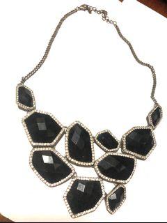 Costume jewelry bib necklace black and diamonds
