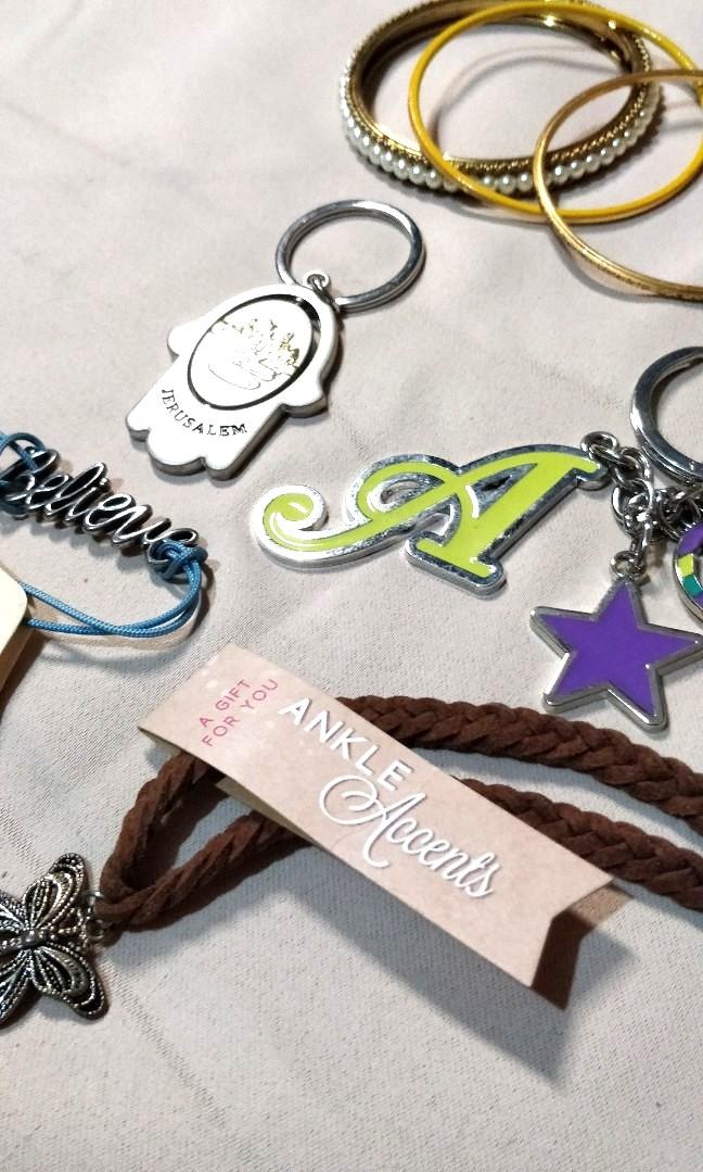 Unused Trinkets Bundle (For Kids) (Category: Other Accessories) located in Cebu City. Submitted by everythingmustgosupersale (Listing ID 1109551198, Image 2). Description: UNUSED TRINKETS: - Jerusalem keychain - Letter A keychain - Pearl bangle (for kids) - 2x thin bangles (for kids) - Believe bracelet - Butterfly anklet No returns, no refunds..